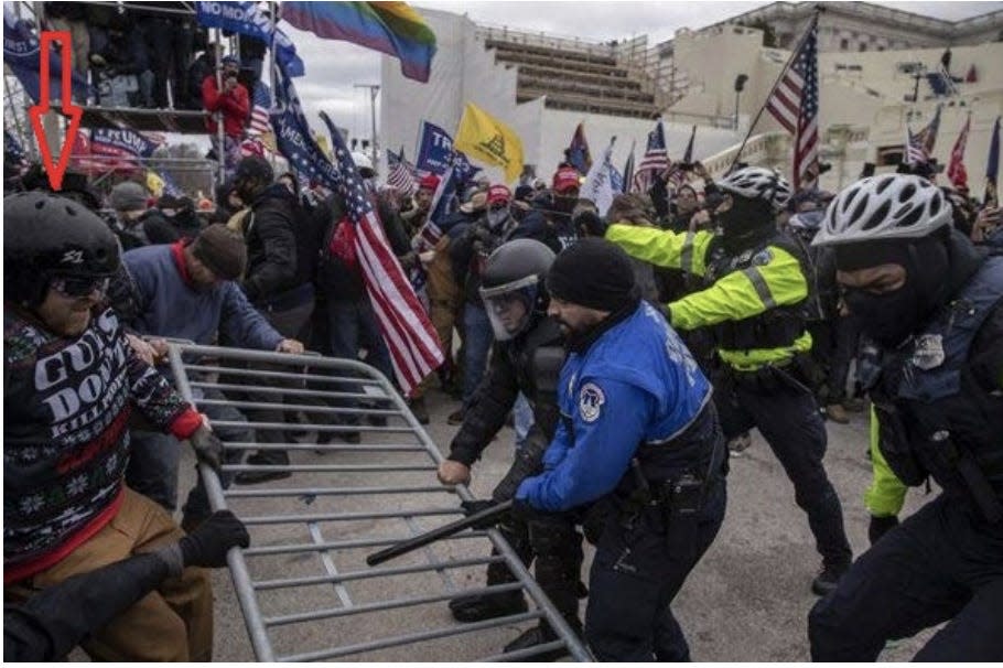 Thomas Patrick Hamner in a "tug-of-war" with police at the Capitol riot.