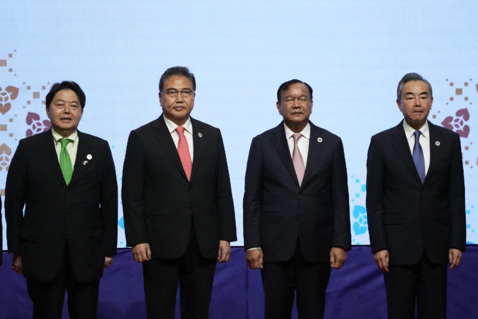 From left to right, Japan's Foreign Minister Yoshimasa Hayashi, South Korean Foreign Minister Park Jin, Cambodia's Foreign Minister Prak Sokhonn and Chinese Foreign Minister Wang Yi stand for group photo during the ASEAN Plus Three Foreign Ministers' Meeting in Phnom Penh, Cambodia, Thursday, Aug. 4, 2022. ( AP Photo/Heng Sinith)
