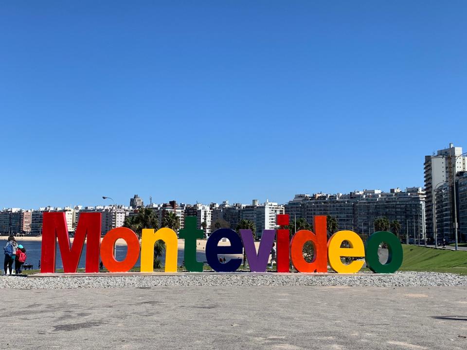 Sign in Montevideo, Uruguay that reads "Montevideo" in rainbow lettering