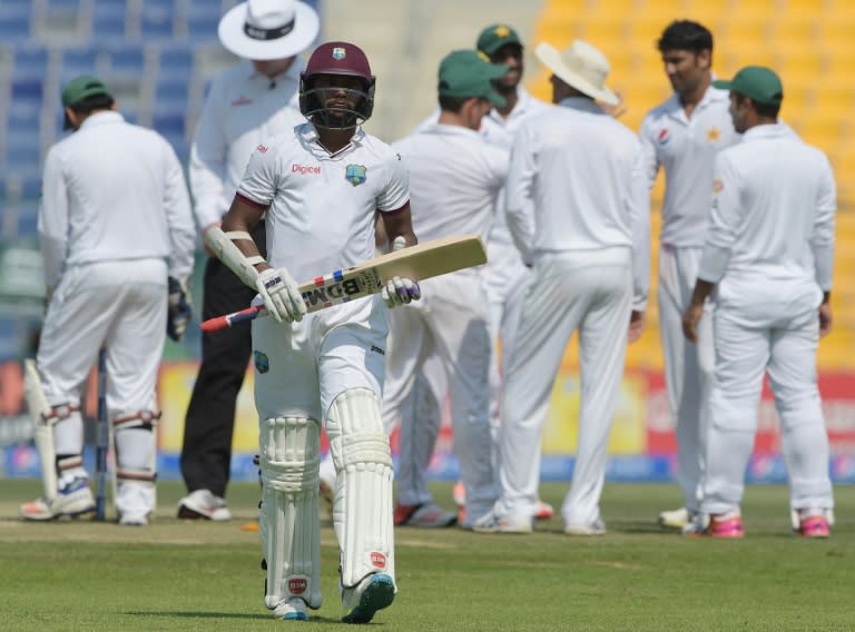 West Indies' batsman Devendra Bishoo walks off after his dismissal on the third day of the second Test against Pakistan at the Sheikh Zayed Cricket Stadium in Abu Dhabi on October 23, 2016