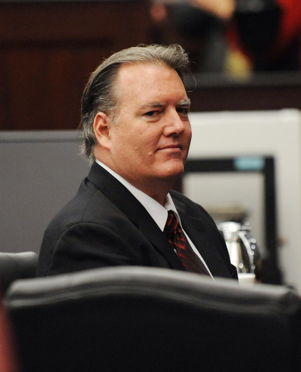 Michael Dunn looks back at his family after the prosecution rested their case against him in Jacksonville, Fla., Monday, Feb. 10, 2014. Dunn is charged with killing a teen after an argument over loud music outside a Jacksonville convenience store in 2012. (AP Photo/The Florida Times-Union, Bob Mack, Pool)