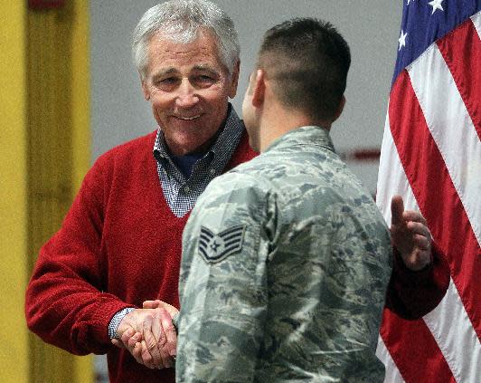 Defense Secretary Chuck Hagel greets an airman from the 20th Air Force 90th Missile Wing during a trip to F.E. Warren Air Force Base on Thursday, Jan. 9, 2014 in Cheyenne, Wyo. It was the first time since 1982 that a defense secretary has visited the nuclear missile base. (AP Photo/Wyoming Tribune Eagle, Blaine McCartney)