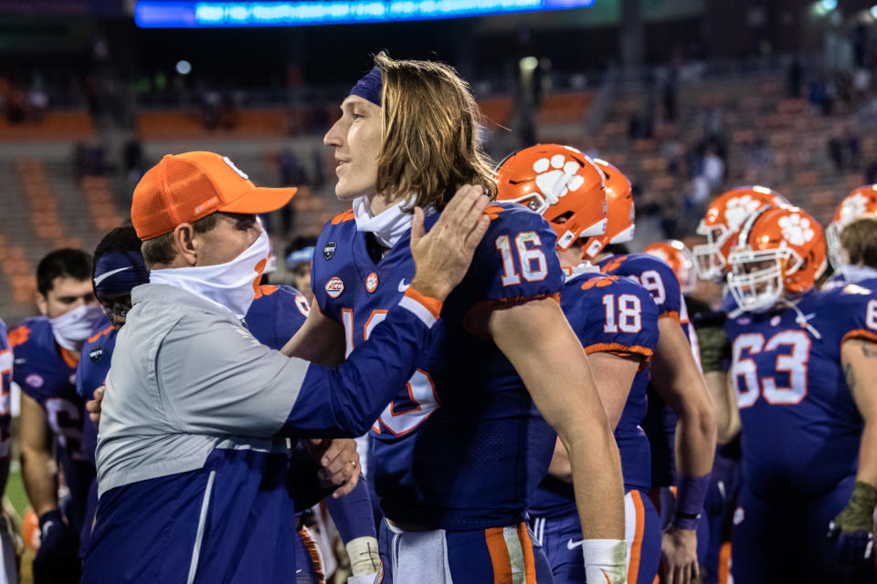 Nov 28, 2020; Clemson, SC, USA; Clemson head coach Dabo Swinney pats Clemson quarterback Trevor Lawrence (16) on the shoulder following their 52-17 win over Pittsburgh at Memorial Stadium. Mandatory Credit: Ken Ruinard-USA TODAY Sports