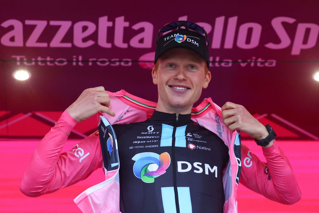  Team DSMs Norwegian rider Andreas Leknessund celebrates his overall leaders pink jersey on the podium after the fourth stage of the Giro dItalia 2023 cycling race 175 km between Venosa and Lago Laceno on May 9 2023 Photo by Luca Bettini  AFP Photo by LUCA BETTINIAFP via Getty Images 