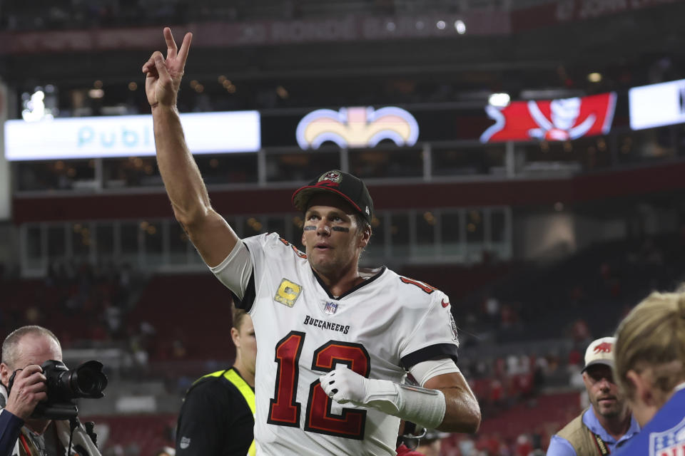 Tampa Bay Buccaneers quarterback Tom Brady (12) waves to spectators after an NFL football game between the Los Angeles Rams and Tampa Bay Buccaneers, Sunday, Nov. 6, 2022, in Tampa, Fla. The Buccaneers defeated the Rams 16-13. Brady become the first player in NFL history with over 100,000 career passing yards. (AP Photo/Mark LoMoglio)