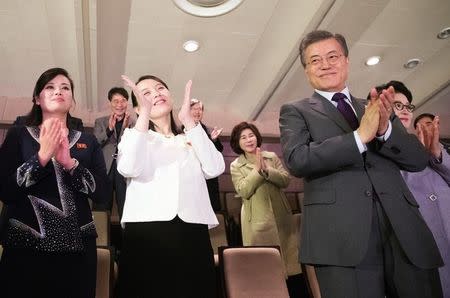 South Korean President Moon Jae-in and Kim Yo Jong, the sister of North Korea's leader Kim Jong Un applaud after watching North Korea's Samjiyon Orchestra's performance in Seoul, South Korea, February 11, 2018. Yonhap via REUTERS