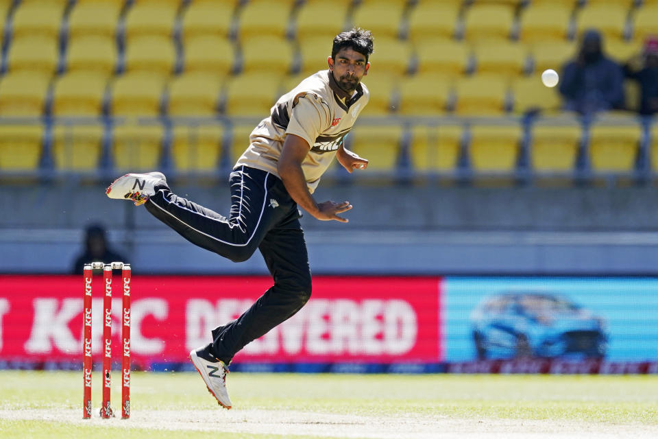 New Zealand's Ish Sodhi bowls to Australia during their 5th T20 cricket international match at Wellington Regional Stadium in Wellington, New Zealand, Sunday, March 7 , 2021. (John Cowpland/Photosport via AP)