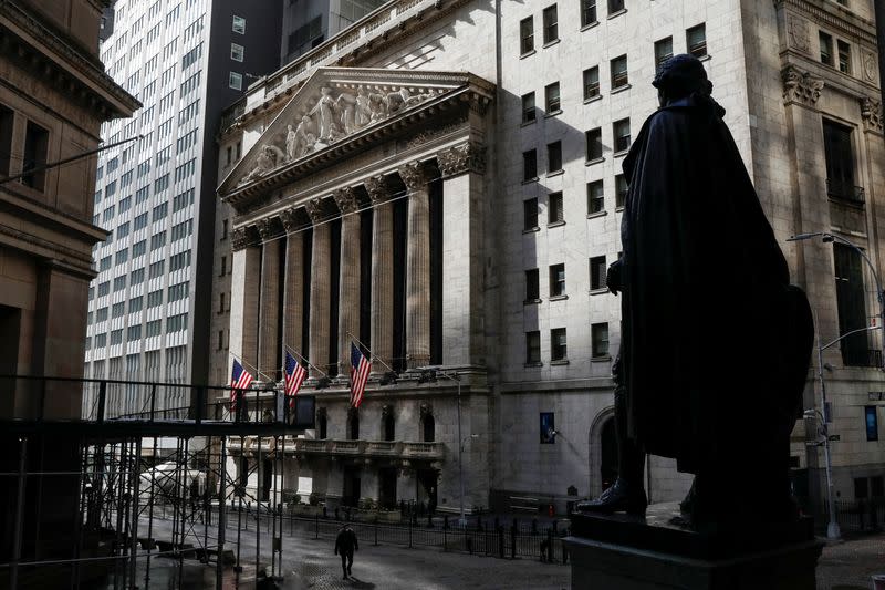 A statue of George Washington is seen on Wall St. across from the NYSE is seen in New York