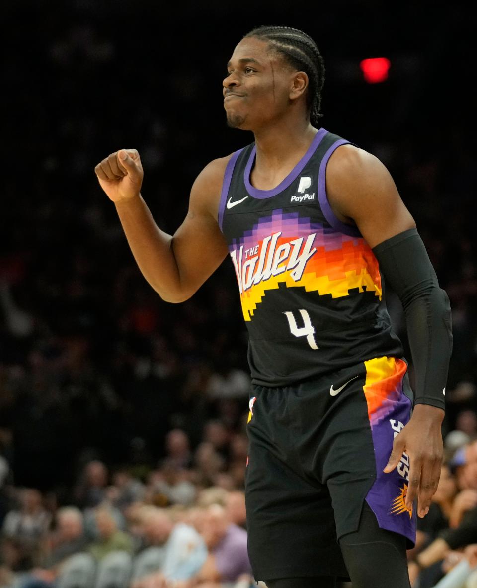 Apr 10, 2022; Phoenix, Ariz. U.S.;  Phoenix Suns guard Aaron Holiday (4) reacts after missing a shot against the Sacramento Kings during the first quarter at Footprint Center.