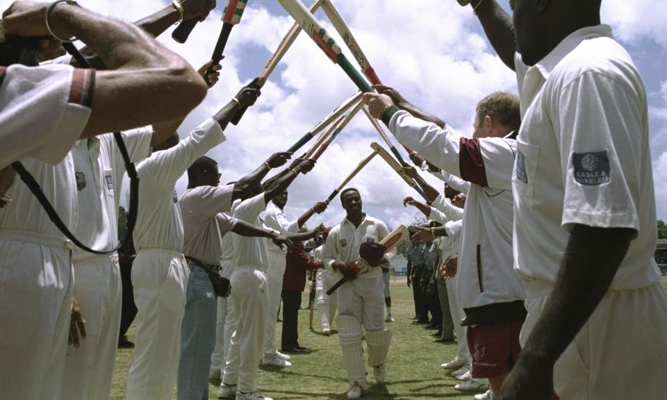 <span>Brian Lara’s West Indies teammates form a guard of honour after his 375 against England at Antigua in 1994.</span><span>Photograph: Ben Radford/Getty Images</span>