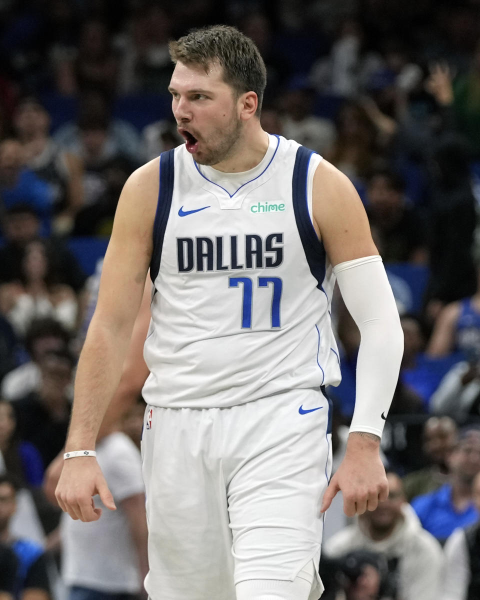 Dallas Mavericks guard Luka Doncic (77) reacts after sinking a 3-point shot in the final moments of an NBA basketball game against the Orlando Magic, Monday, Nov. 6, 2023, in Orlando, Fla. (AP Photo/John Raoux)