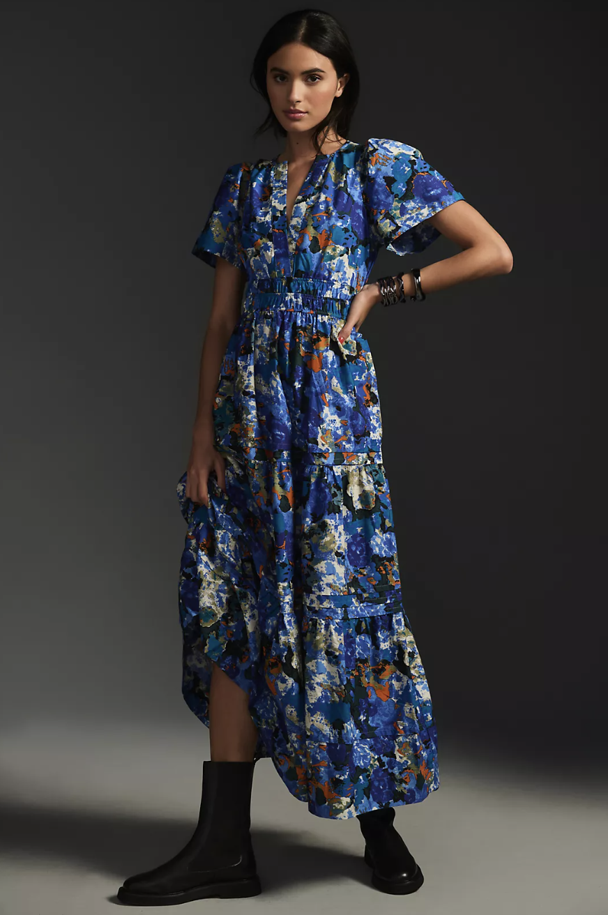 model wearing black boots and blue floral The Somerset Maxi Dress (photo via Anthropologie)