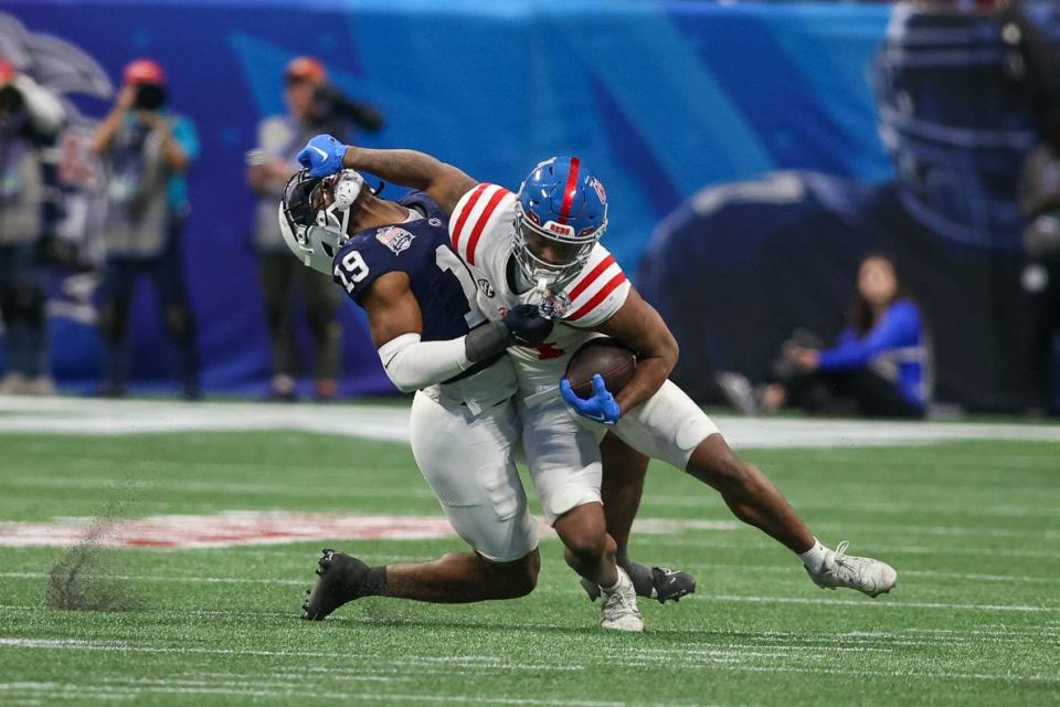 Dec 30, 2023; Atlanta, GA, USA; Mississippi Rebels running back Quinshon Judkins (4) stiff arms Penn State Nittany Lions defensive end Jameial Lyons (19) in the second half at Mercedes-Benz Stadium. Mandatory Credit: Brett Davis-USA TODAY Sports