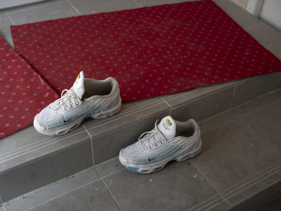 A student's shoes sit outside the entrance to the mosque at Ibn Khaldoun, a private Muslim school, in Marseille, southern France, Tuesday, April 16, 2024. (AP Photo/Daniel Cole)