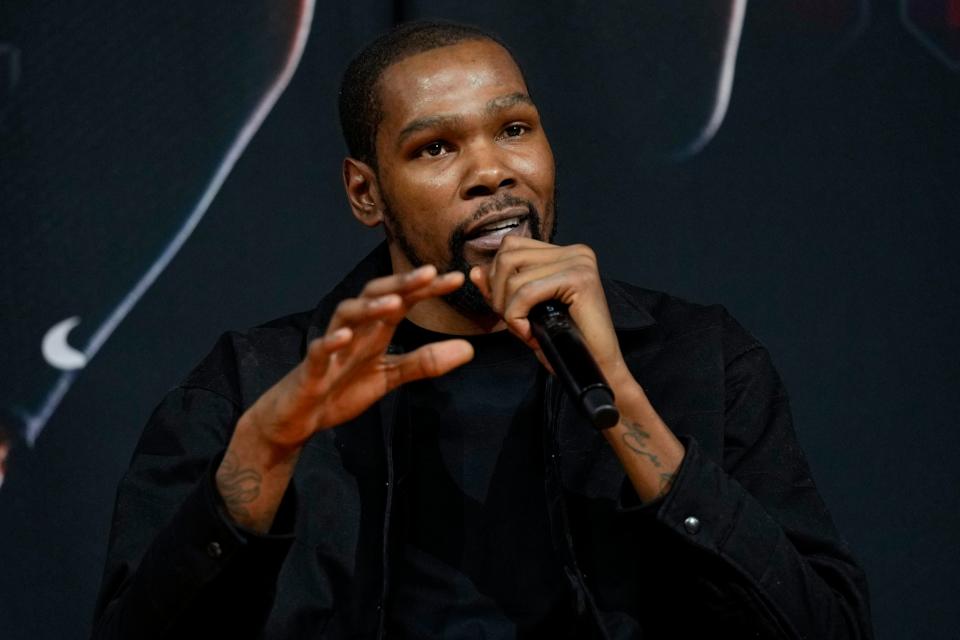 Phoenix Suns forward Kevin Durant, speaks to the media after being introduced during an NBA basketball team availability, Thursday, Feb. 16, 2023, in Phoenix. (AP Photo/Matt York)