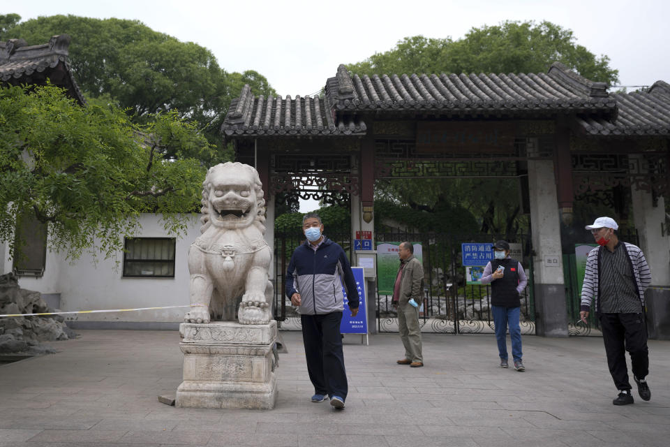 Residents leave after being turned away from a public park which was closed due to pandemic measures in the Chaoyang district on Tuesday, May 10, 2022, in Beijing. Beijing, the capital, began another round of three days of mass testing for millions of its residents Tuesday in a bid to prevent an outbreak from growing to Shanghai proportions. (AP Photo/Andy Wong)