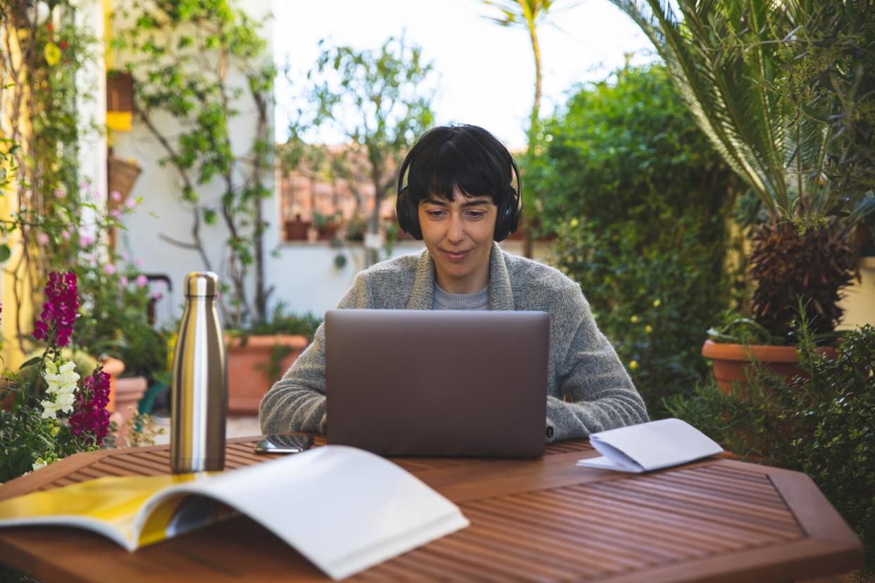 Woman at work from home patio