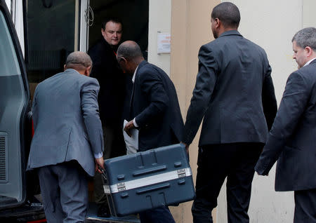 FILE PHOTO: Men unload a case containing the black boxes from the crashed Ethiopian Airlines Boeing 737 MAX 8 outside the headquarters of France's BEA air accident investigation agency in Le Bourget, north of Paris, France, March 14, 2019. REUTERS/Philippe Wojazer/File Photo