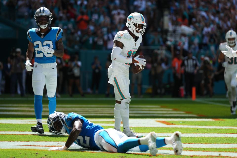 Oct 15, 2023; Miami Gardens, Florida, USA; Miami Dolphins wide receiver Jaylen Waddle (17) celebrates his touchdown against the Carolina Panthers during the first half at Hard Rock Stadium. Mandatory Credit: Jasen Vinlove-USA TODAY Sports