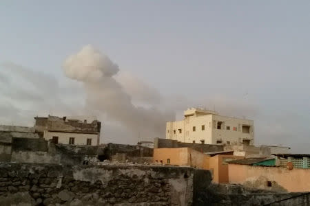 Smoke rises after car bombs explode in Mogadishu, Somalia February 23, 2018. Universal TV via REUTERS