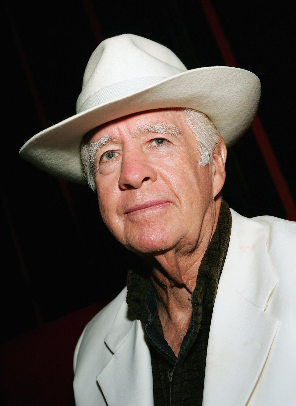 Actor Clu Gulager poses during the after party at the Little Buddha restaurant following the premiere of the movie "Feast" at the Palms Casino Resort September 12, 2006 in Las Vegas, Nevada. The horror film, directed by his son John Gulager, was made possible and documented by the third season of the television series "Project Greenlight."