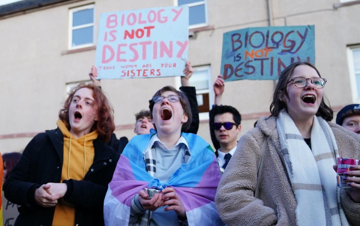 Trans rights activists take part in a demonstration outside Portobello Library, Edinburgh, where parents are attending a meeting, organised by Concerned Adults Talking Openly About Gender Identity Ideology, to discuss transgender ideology in Scottish schools. - Jane Barlow/PA