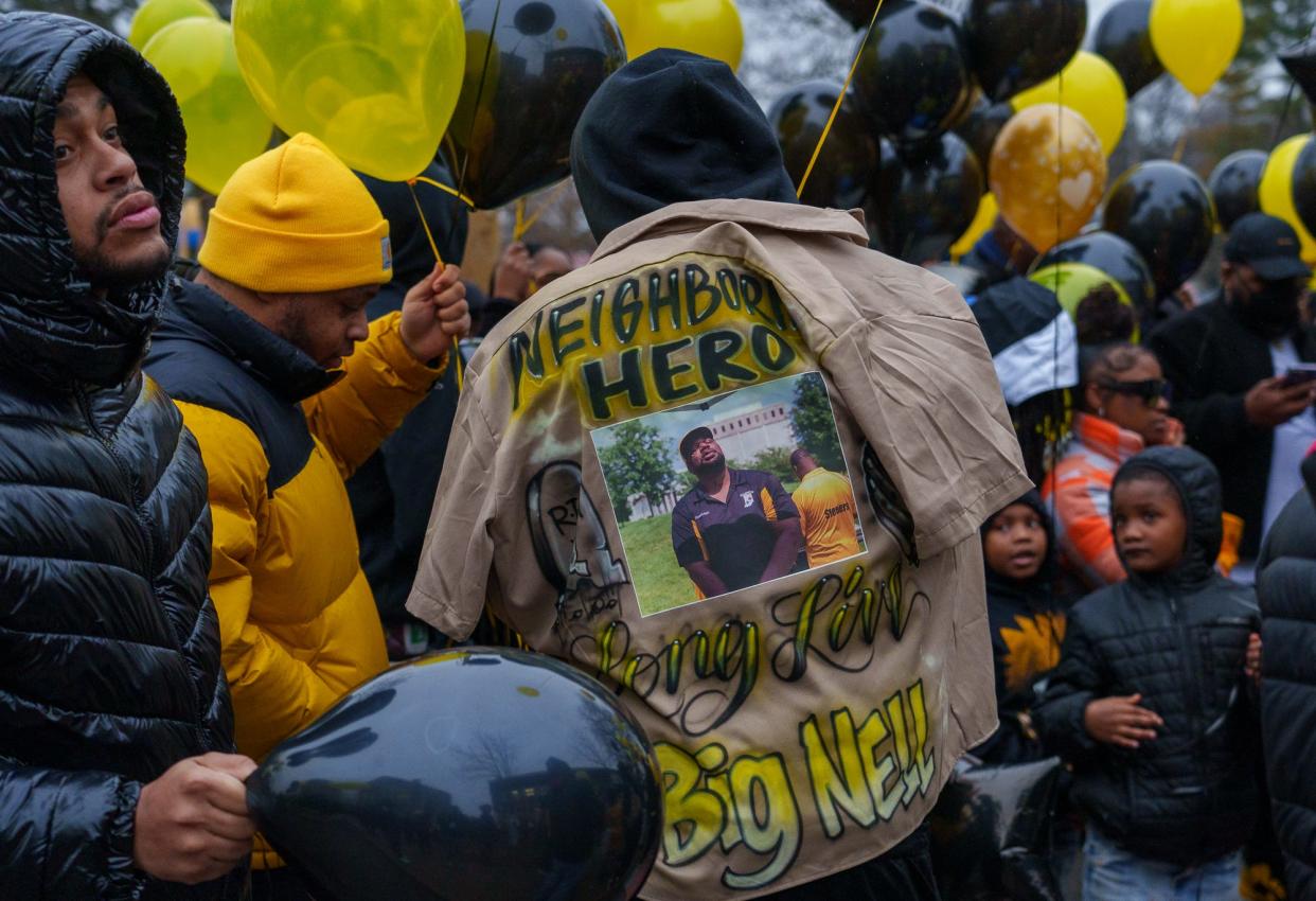 Community members gather Monday, Jan. 16, 2023, for a balloon release and memorial in honor of the late Richard Donnell Hamilton, or Coach Nell as he was known to the Indy Steelers youth football program. According to the Indiana State Police, Hamilton was shot during a road rage incident last week. 