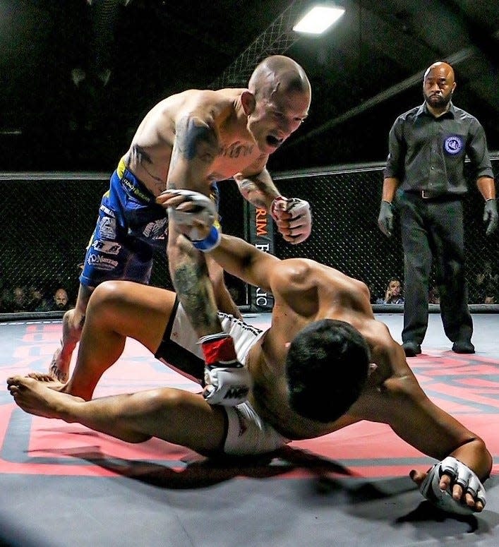 Elco wrestling coach Ben Moser, top, is also a mixed martial arts fighter. Since going pro in 2018, Moser is 2-1 in cage fights.