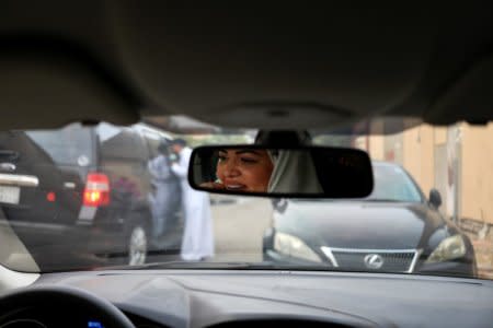 Dr Samira al-Ghamdi, 47, a practicing psychologist, drives around the side roads of a neighborhood as she prepares to hit the road on Sunday as a licensed driver, in Jeddah, Saudi Arabia June 21, 2018. Picture taken June 21, 2018. REUTERS/Zohra Bensemra