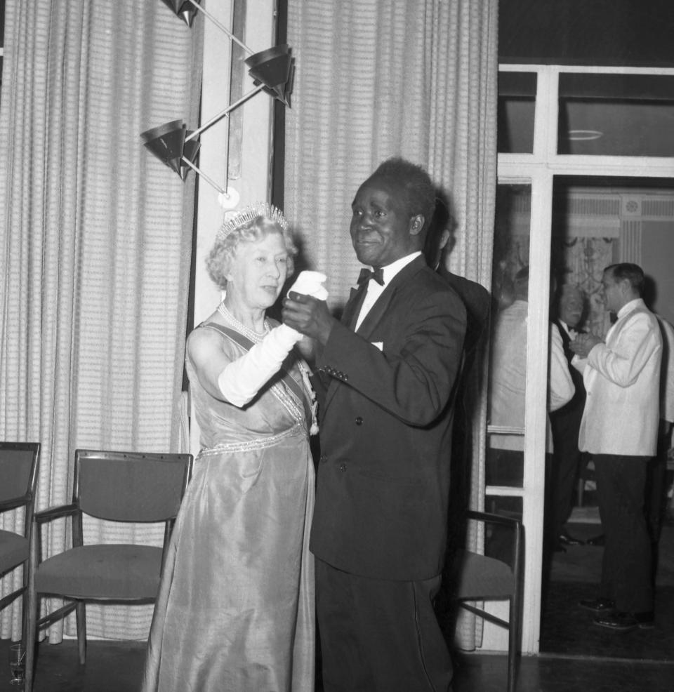 FILE - In this Oct. 24, 1964 file photo, President Kenneth Kaunda of Zambia and Britain's Mary, The Princess Royal, who is representing Queen Elizabeth II, dance at the State Ball during the Zambia independence celebrations in Lusaka, Zambia. Zambia’s first president Kenneth Kaunda has died at the age of 97, the country's president Edward Lungu announced Thursday June 17, 2021. (AP Photo/Dennis-Lee Royle, File)