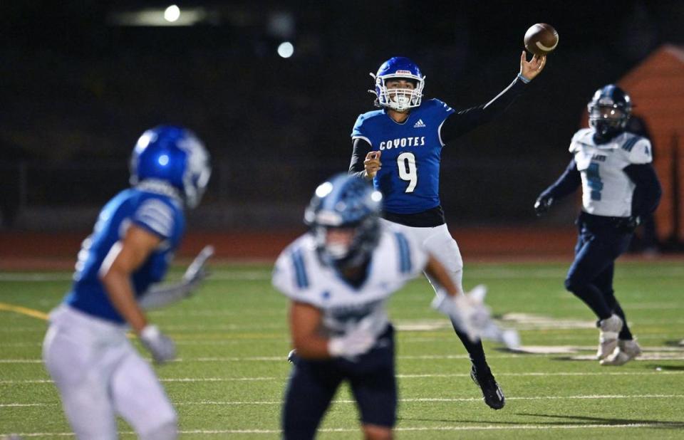 Madera quarterback Joel Arellano, backgroound passes to Michael Pedro, left, covered by Bullard’s Dominick Gonzalez, bottom right, in a CMAC game Friday, Sept. 29, 2023 in Madera. Madera led 6-0 at halftime, but Bullard rallied for the 7-6 win.