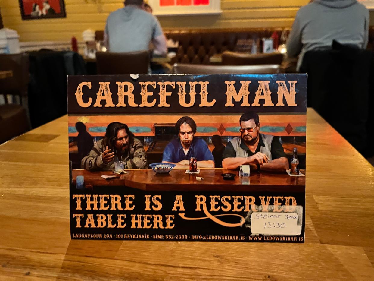 A sign on a table at Lebowski Bar in Iceland.
