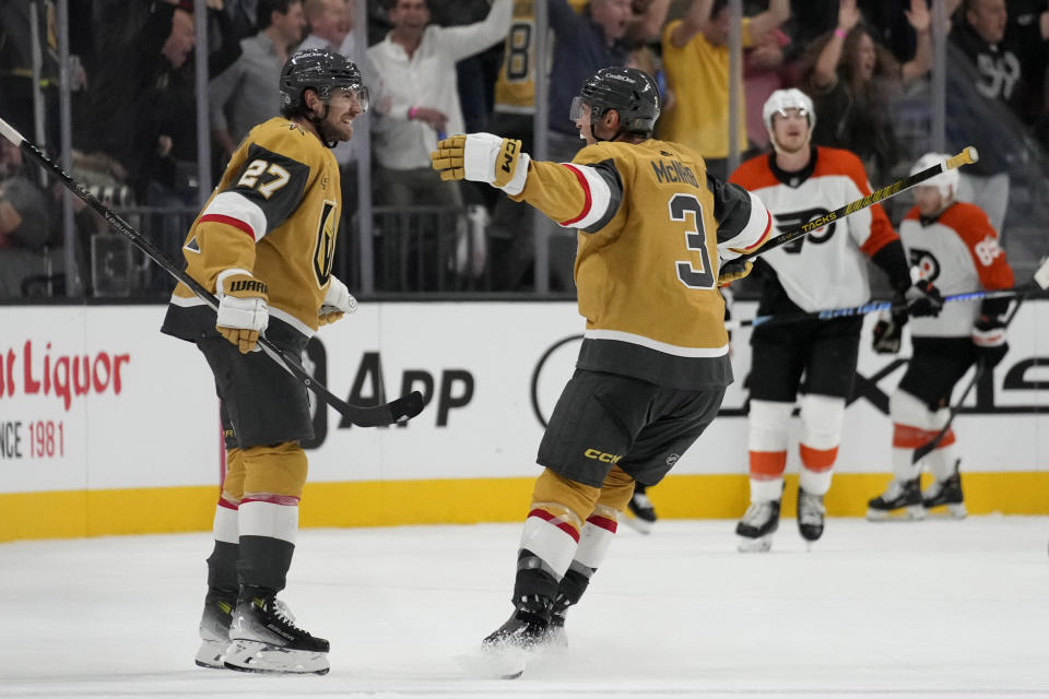 Vegas Golden Knights defenseman Shea Theodore (27) celebrates after scoring against the Philadelphia Flyers during the third period of an NHL hockey game Tuesday, Oct. 24, 2023, in Las Vegas. (AP Photo/John Locher)