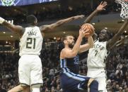 Nov 14, 2018; Milwaukee, WI, USA; Memphis Grizzlies center Marc Gasol (33) takes a shot between Milwaukee Bucks guard Tony Snell (21) and forward Thon Maker (7) in the fourth quarter at Fiserv Center. Benny Sieu-USA TODAY Sports