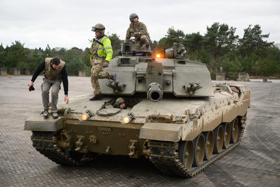 Ukrainian recruits and their British Armed Forces trainers complete a session on the operation of a Challenger II tank at a military facility, on February 23, 2023 in Southern England.