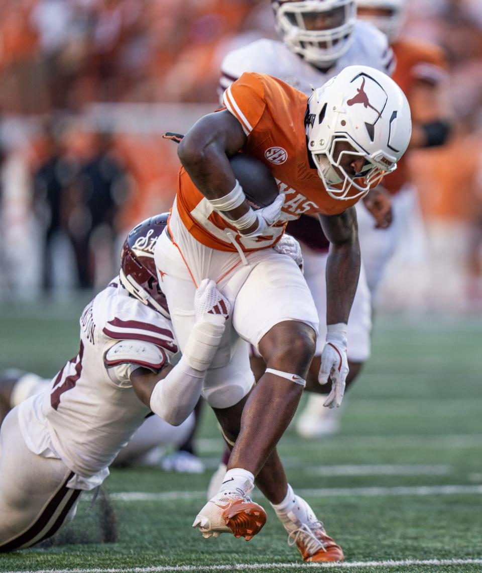 Texas running back Quintrevion Wisner tries to break free from a Mississippi State tackler in last week's win over the Bulldogs at Royal-Memorial Stadium. Head coach Steve Sarkisian said Wisner "gave us a really nice spark in the game."