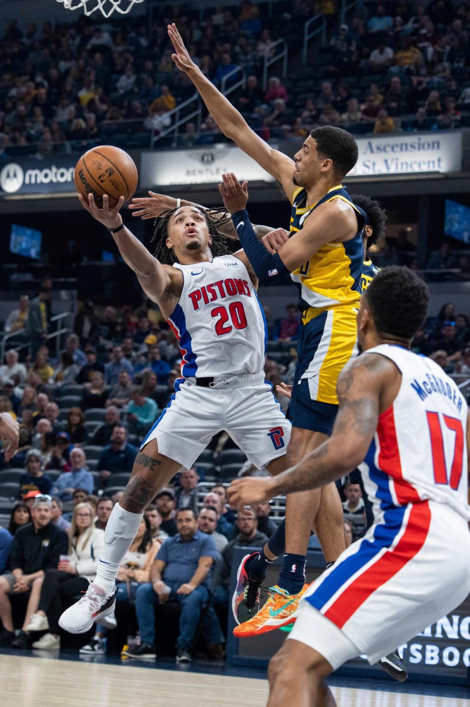 Detroit Pistons gaurd Carson Edwards (20) shoots the ball while Indiana Pacers guard Tyrese Haliburton (0) defends in the first half at Gainbridge Fieldhouse in Indianapolis on Sunday, April 3, 2022.
