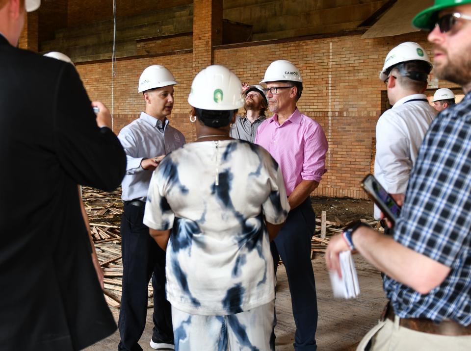 Former Labor Secretary Tom Perez, current Director of the White House Office of Intergovernmental Affairs, listens to Lansing Mayor Andy Schor during a tour, Tuesday, July 30, 2024, at the former Walter French Junior School in Lansing.