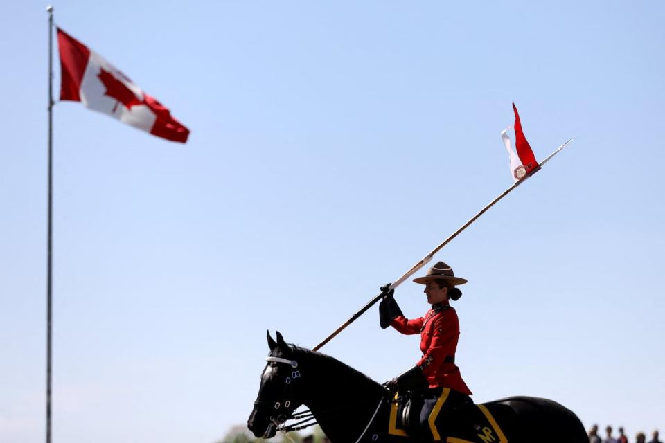 A member of Royal Canadian Mounted Police (RCMP) rides a horse, during a special performance of the Musical Ride, for the visit of Britain's Prince Charles (not pictured) and Camilla, Duchess of Cornwall (not pictured), on the second day of their Canadian 2022 Royal Tour in Ottawa, Ontario, Canada May 18, 2022.