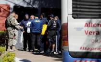 Detained fans of Boca Juniors football club are pictured at the headquarters of the Special Operations Forces of the Paraguayan Police in Asuncion, Paraguay, April 29, 2016. REUTERS/Jorge Adorno