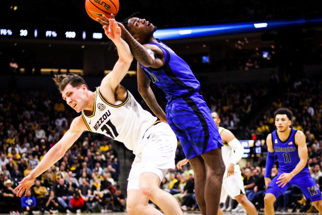 Missouri's Caleb Grill (31) fights with Memphis' Jaykwon Walton during a college basketball game at Mizzou Arena on Nov. 10, 2023, in Columbia, Mo.
