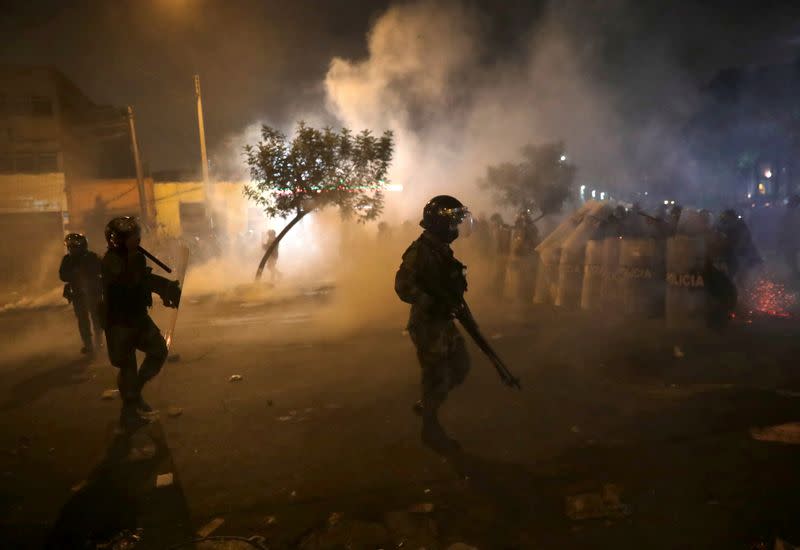 FILE PHOTO: Demonstrators clash with police during protests following the impeachment of President Martin Vizcarra, in Lima