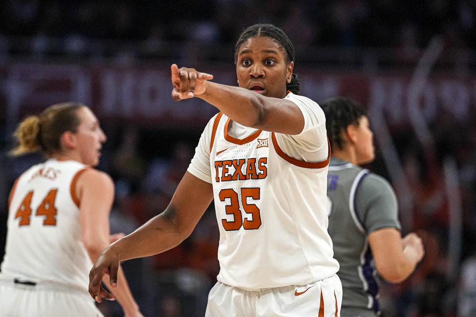 Longhorns guard Madison Booker directs her team in the 61-54 win over Kansas State at Moody Center on Sunday. Booker rebounded from a shaky first half to finish with 20 points and six assists.