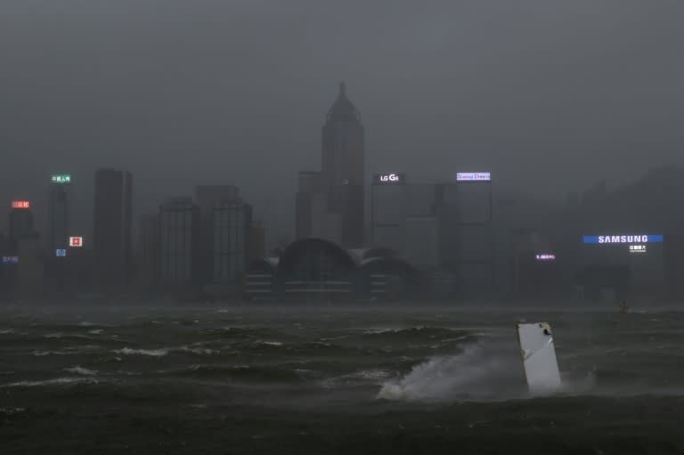 Hong Kong's skyline seen across Victoria harbour had a dark, foreboding air as Severe Typhoon Hato smashed through the city