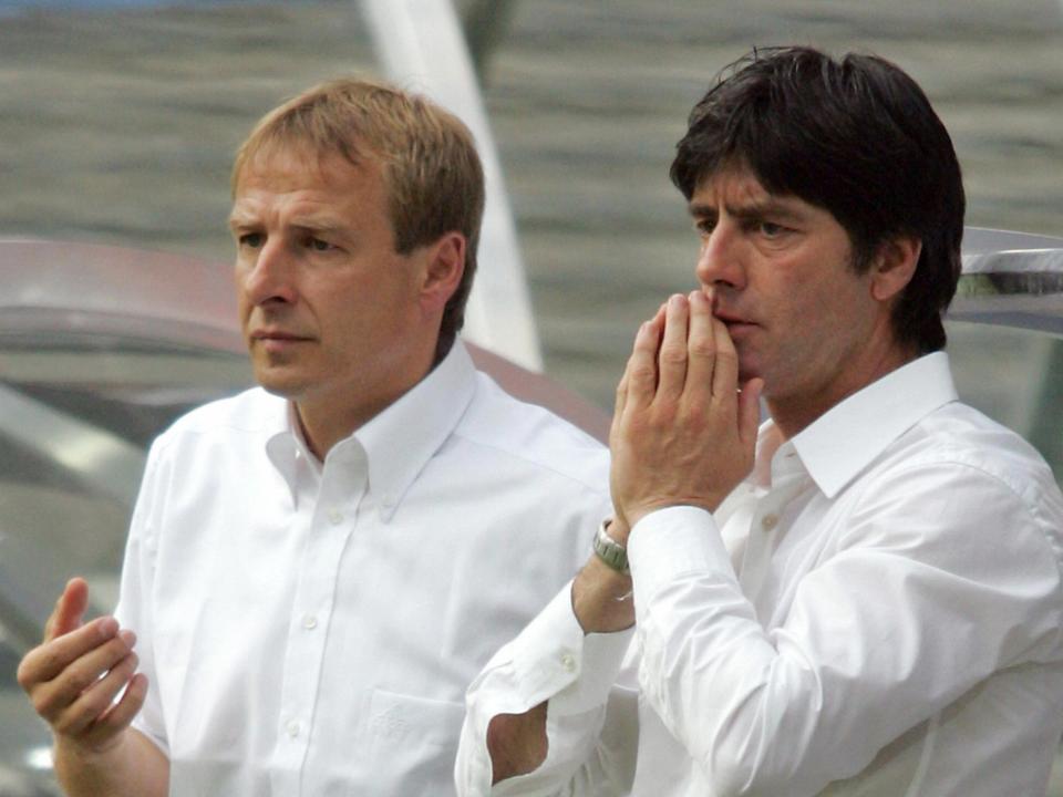 Jürgen Klinsmann (left) with Joachim Löw in the Germany dugout in 2005 (AFP via Getty Images)