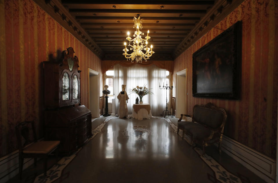 This picture taken on Wednesday, May 13, 2020 shows an empty hall of the Ca' Nigra lagoon resort hotel along the canal grande in Venice, Italy. The hotel is currently closed to the public after lockdown measures to prevent the spread of COVID-19 brought national and International leisure travel to a halt. (AP Photo/Antonio Calanni)