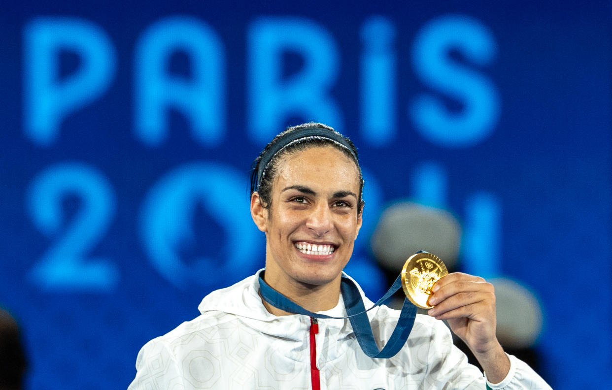 PARIS, FRANCE - AUGUST 09: Imane Khelif of Team Algeria celebrates as she wins gold medal after defeating Liu Yang (blue) of China in the Boxing Women's 66kg Final match on day fourteen of the Olympic Games Paris 2024 at Roland Garros on August 09, 2024 in Paris, France. (Photo by Aytac Unal/Anadolu via Getty Images)