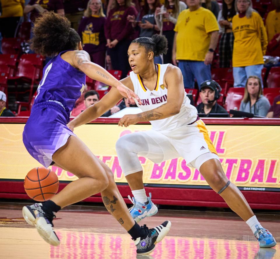 Arizona State Sun Devils guard Trayanna Crisp (4) drives against Washington Huskies guard Jayda Noble (3) at Desert Financial Arena on Sunday, Jan. 29, 2023.