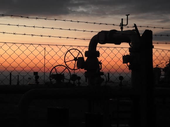 A natural gas pipeline at sunset.