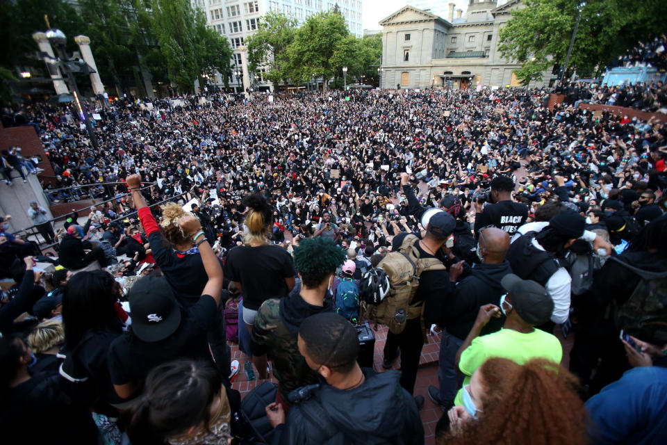 FILE - In this June 2, 2020, file photo, a crowd gathers in Pioneer Square in downtown Portland, Ore., as protests continued against the death of George Floyd. Thousands of protesters in the liberal and predominantly white city have taken to the streets peacefully every day for more than five weeks to decry police brutality, but recent violence by smaller groups is creating a deep schism in the protest movement and prompting allegations that white protesters are co-opting the moment. (Sean Meagher/The Oregonian via AP, File)